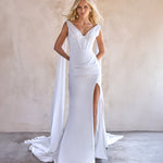 Jani satin wedding dress by the bryde. exposed boning bodice with thigh high split and satin wings